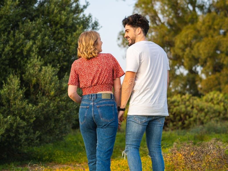 Back View Of A Happy Spanish Couple Spending Leisure Time Together Stock Image Image Of Female