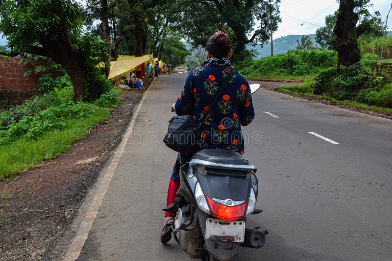 girl riding scooty