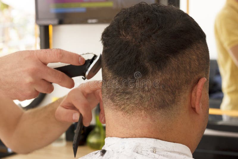 Back View of Man Getting Short Hair Trimming at Barber Shop with Clipper  Machine Stock Photo - Image of male, hairstyle: 132603212