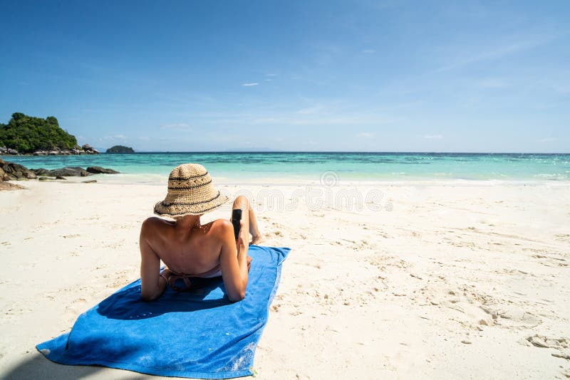 Back View Photo of Carefree Happy Female Tourist Realxing on the Sandy ...