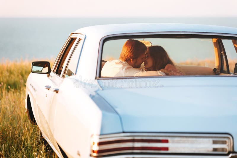 Back view of a smiling attractive couple in love