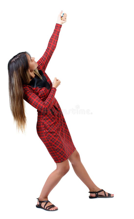 Back view of standing girl pulling a rope from the top or cling royalty free stock images