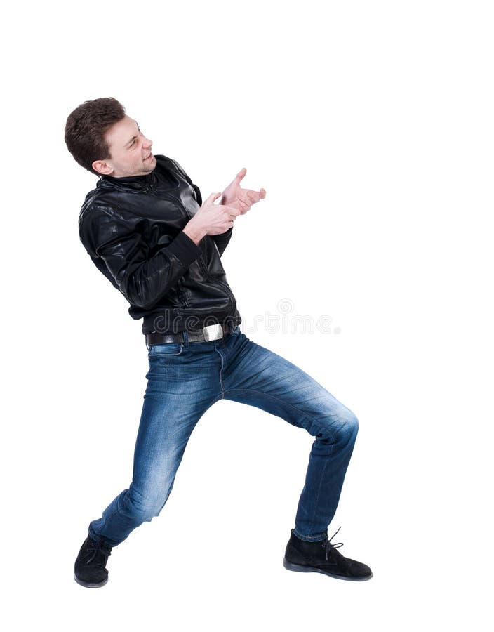 Back view of standing man pulling a rope from the top or cling t royalty free stock image