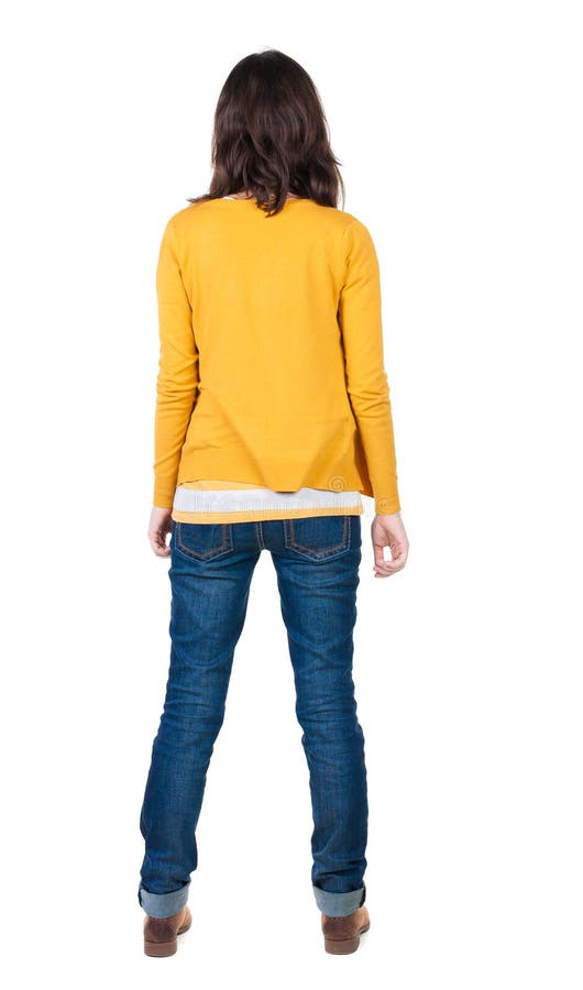Back view of standing young beautiful brunette woman in yellow stock images Back view of standing young beautiful brunette woman in yellow stock images