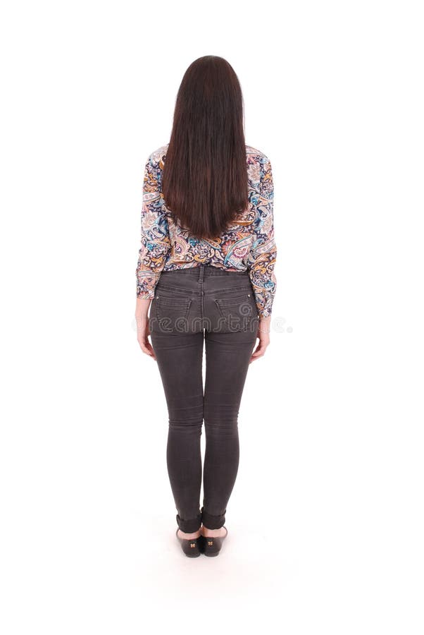 Back view of standing young beautiful woman in jeans. girl watching. royalty free stock images Back view of standing young beautiful woman in jeans. girl watching. royalty free stock images
