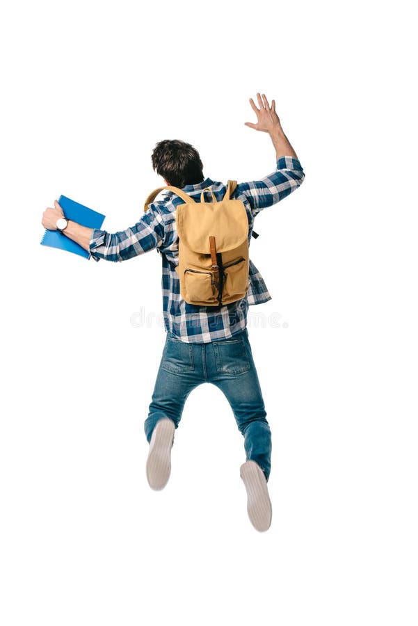 back view of student jumping with backpack and copybook