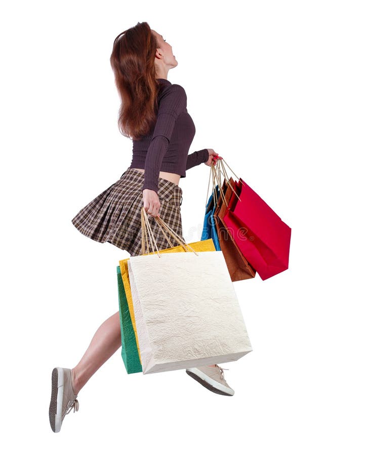 Back View of a Woman Jumping with Shopping Bags Stock Photo - Image of ...