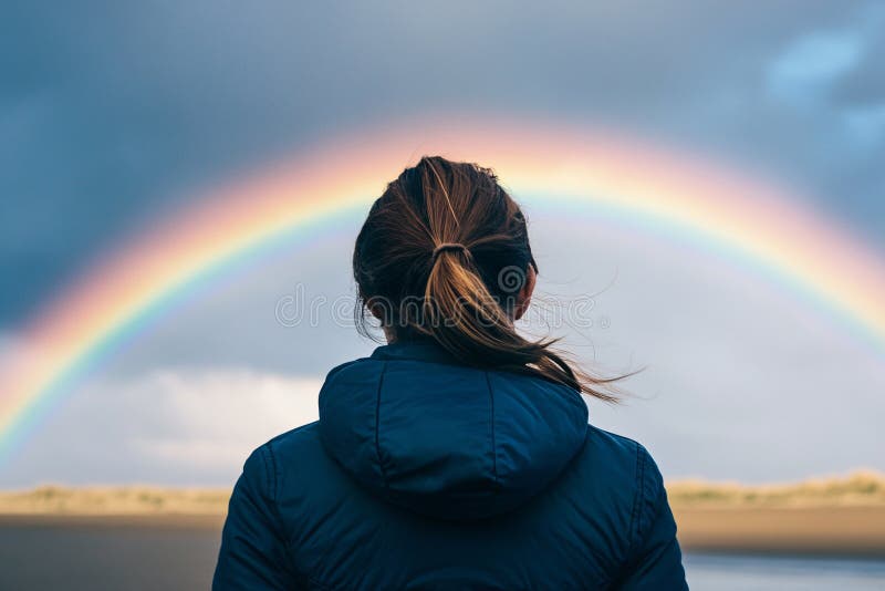 Back view of woman looking at sky with faint rainbow vector illustration