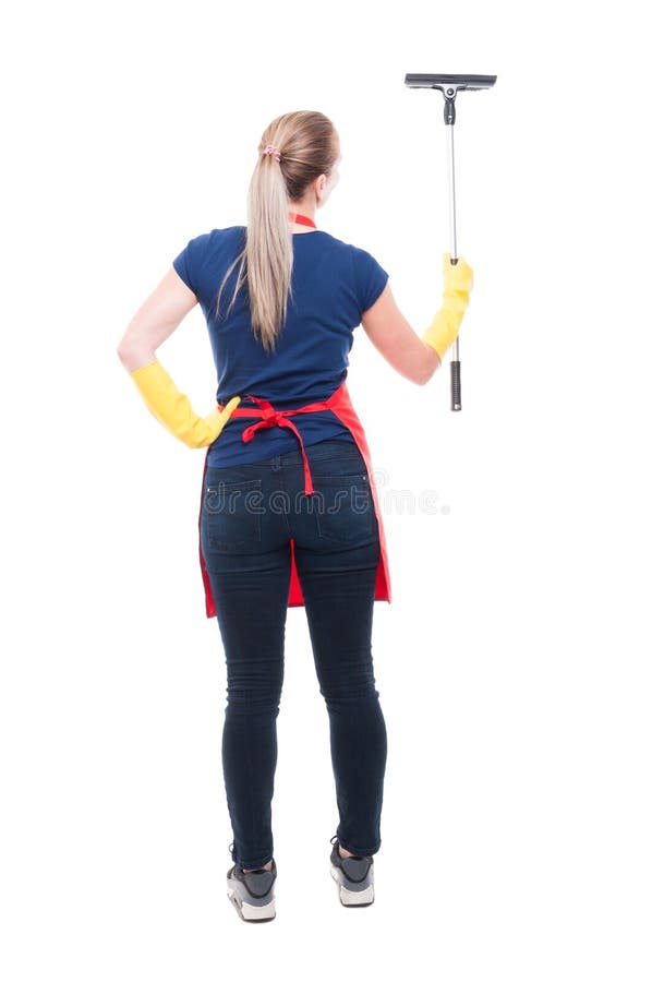 Back view of young housewife with scraper royalty free stock image