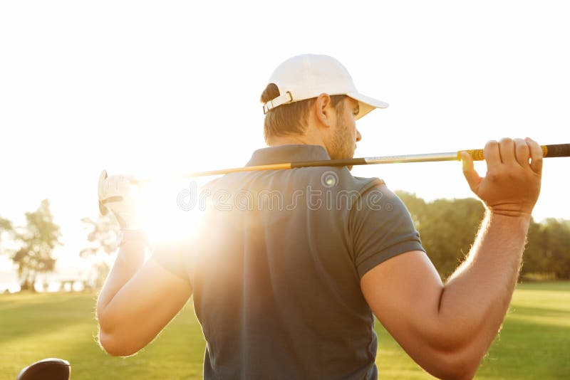 Back View of a Young Man Carrying Golf Club Stock Photo Image of