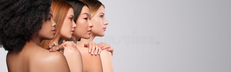 Diverse women touching naked shoulders