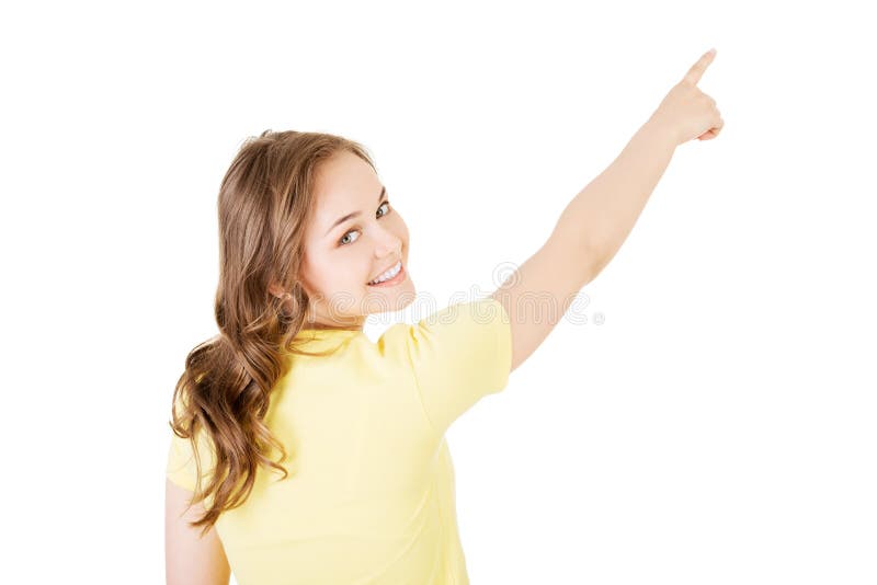 Back view young woman pointing up to the corner royalty free stock photos