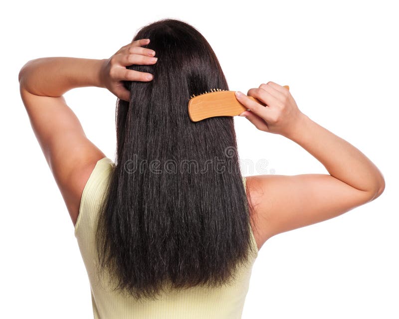 Picture of the back of a woman with long hair with hairbrush on white background