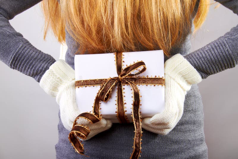 Back of a woman with christmas gift stock images Back of a woman with christmas gift stock images