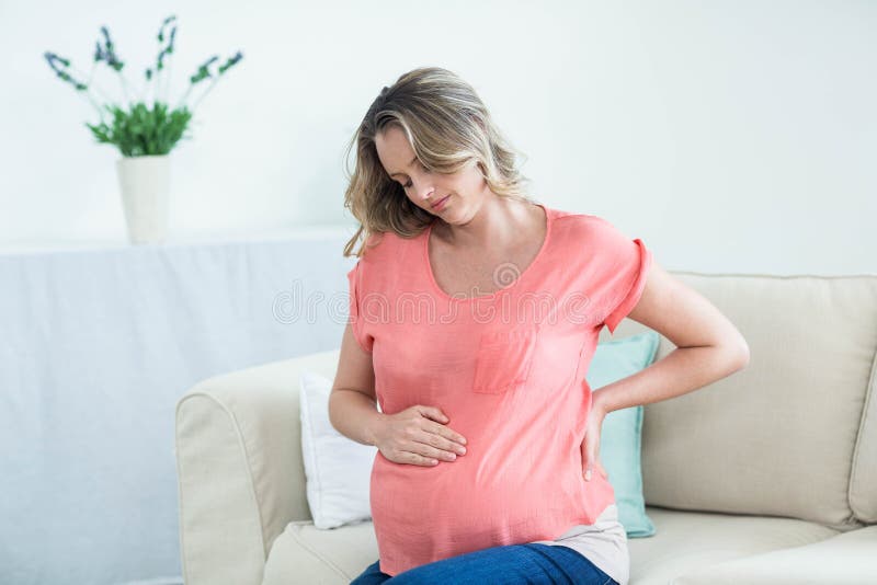backen smärtar gravid kvinna arkivbild backen smärtar gravid kvinna arkivbild