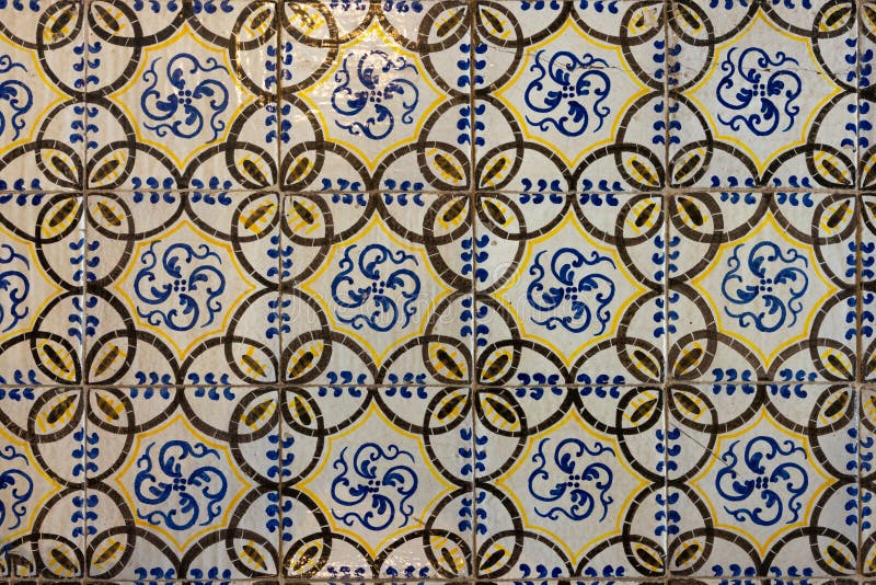 close up of historical square ceramic tiles floor with geometric pattern decorative background