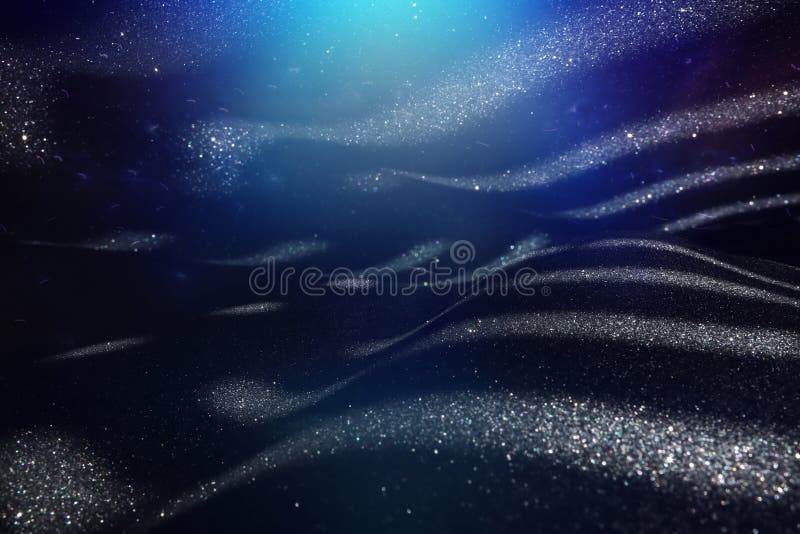 Background of Abstract Blue and Silver Glitter Lights. Defocused Stock