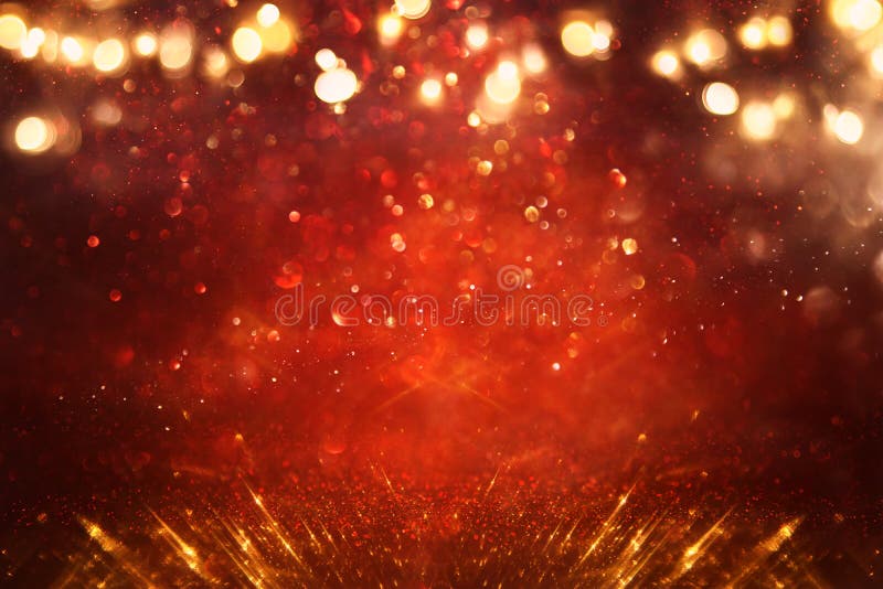 Background of Abstract Red, Gold and Black Glitter Lights. Defocused