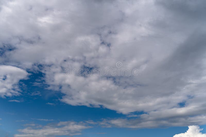 Background with Beautiful Fluffy Clouds and Blue Sky. the Clouds are