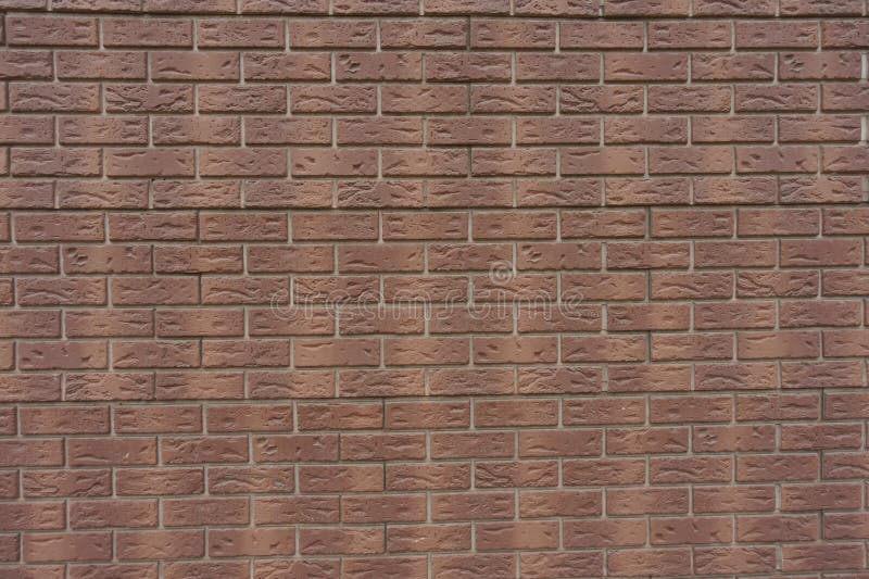 Background - Brown Brick Veneer Wall with Grey Mortar Joints Stock