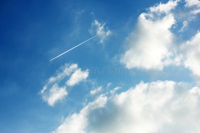 Cloudy blue sky jet trail stock image. Image of airplane - 125622009