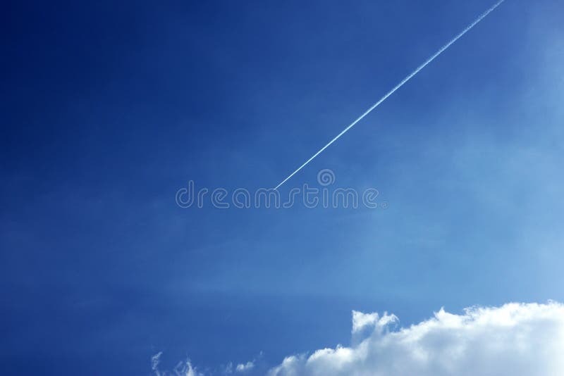 Cloudy blue sky jet trail stock image. Image of background - 125622579