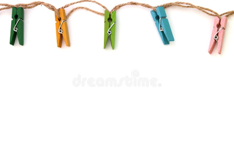 Background of colored linen clothespins on white