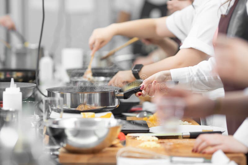 Background cook leads master class in cooking in kitchen royalty free stock photo Background cook leads master class in cooking in kitchen royalty free stock photo