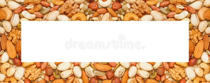 Background in the form of a frame from a variety of nuts and seeds. Flat lay, top view. Horizontal banner royalty free stock images