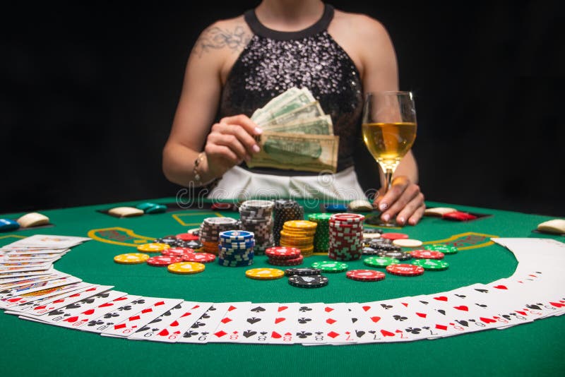 Background of a gaming casino, poker table, cards, chips and a girl with a glass of wine in the background. Background for a gaming business, success..