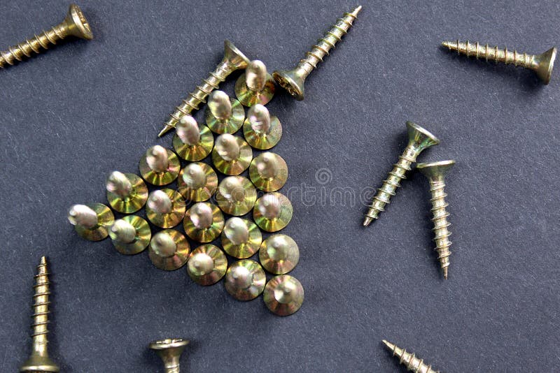 Background, group, pattern, shiny, texture, object, macro, work, metal, equipment, head, small, construction, steel, industrial, photo, iron, repair, screw, black, screws, closeup, technology, mirroring, industry, tool, metallic, part, chrome, engineering, design, abstract, row, arranged, graphic, light, concept, bright, reflection, set, golden, shadow, fthread, tools, mechanic. Mirroring object stock images, royalty-free photos and pictures