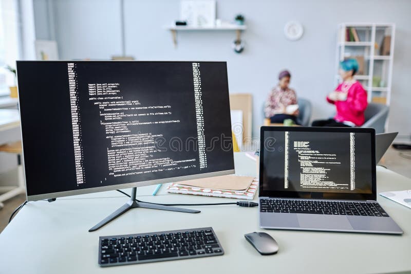 Background Image of Computer Screens with Code Lines on Desk Stock ...