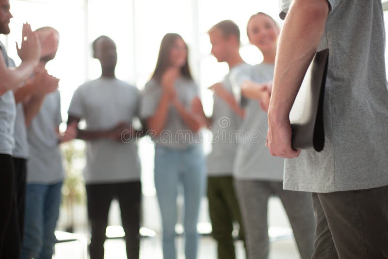 Background image of a group of young people applauding stock photography
