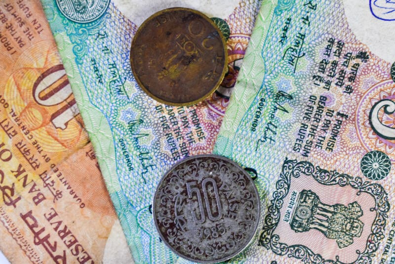 Background Image Of Old Indian Currency Notes And Coins Stock Image background-image-of-old-indian-currency-notes-and-coins-stock-image
