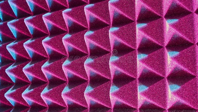 Background image of recording studio sound dampening acoustical foam. red light