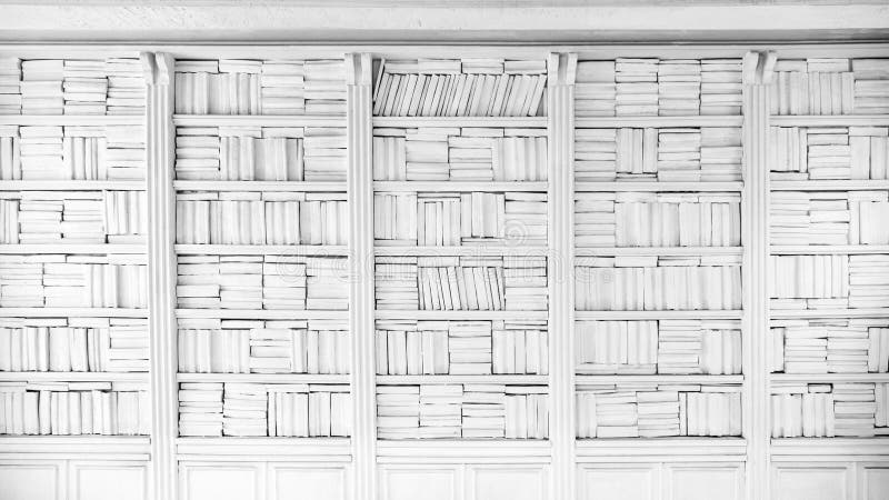 Background of large bookshelf on the wall. Many books in the side. White textured wall background. White wall background