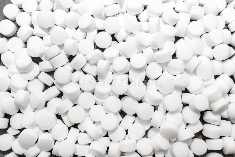 Background Made of Salt Tablets for a Water Softener, Large Round Cubes. Stock Photo Image of