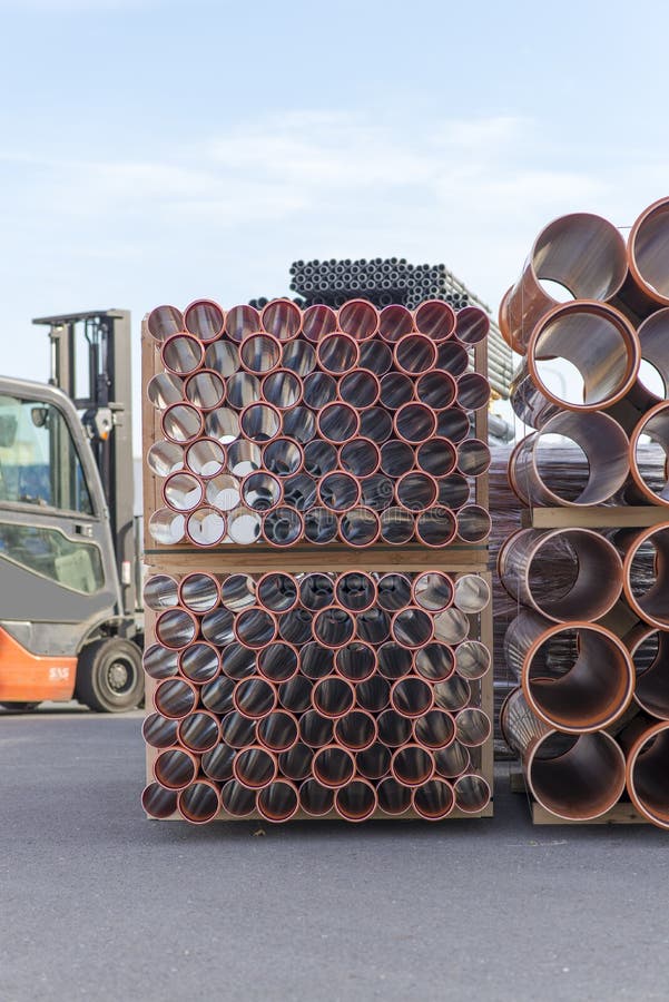 Background of Orange Plastic Sewage Pipes Used at the Building Site