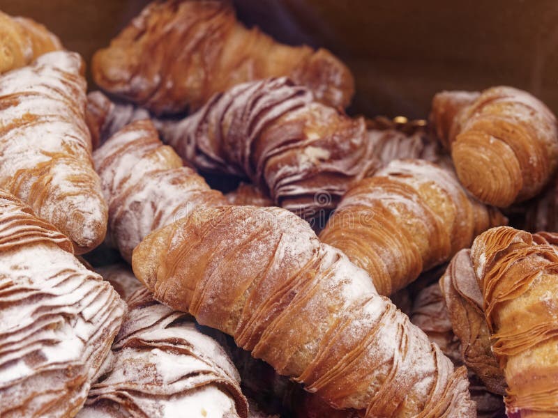 background of pastries called SFOGLIATELLA the typical dessert of the Italian Campania region and of the city of Naples