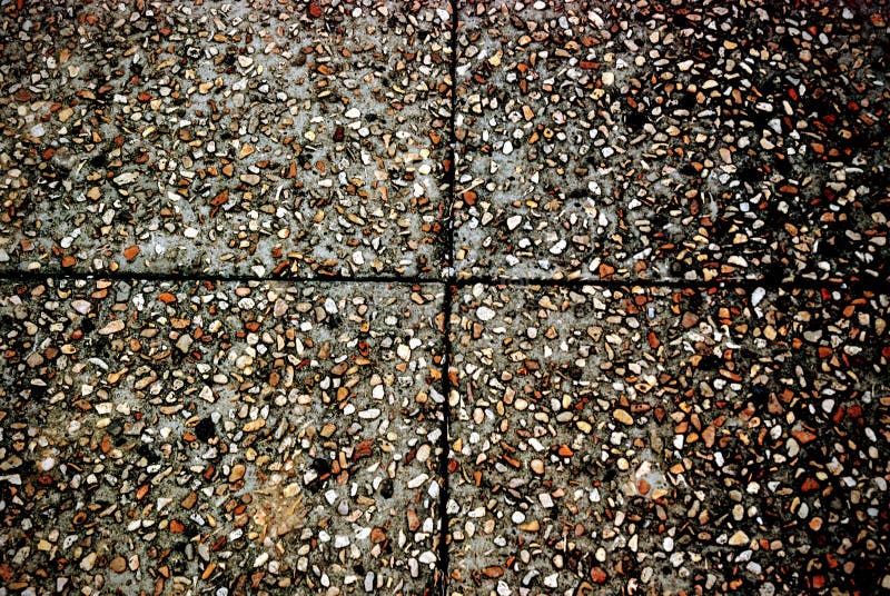 Background picture of stone tiles with brown, black, gray, and orange pebbles and crossing lines stock image Background picture of stone tiles with brown, black, gray, and orange pebbles and crossing lines stock image