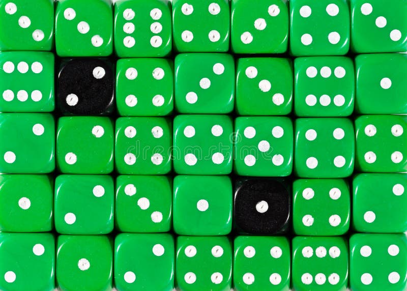 Background of random ordered green dices with two black cubes royalty free stock image