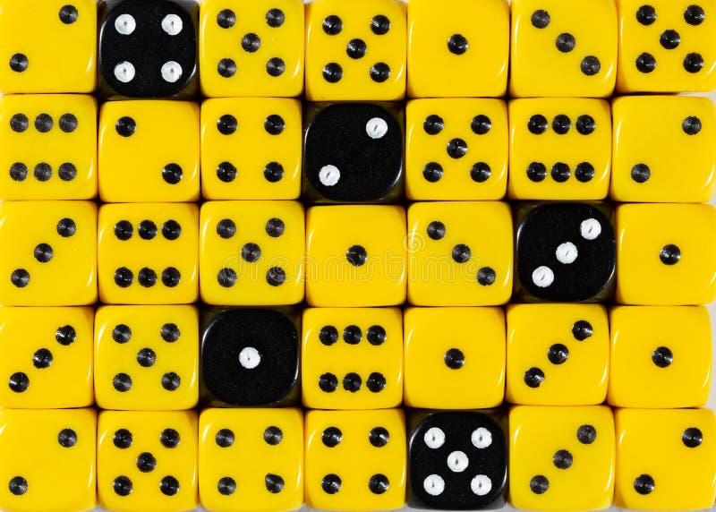 Background of random ordered yellow dices with five black cubes royalty free stock images