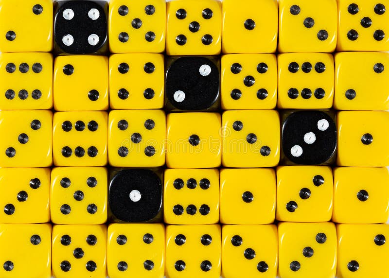 Background of random ordered yellow dices with four black cubes stock photos