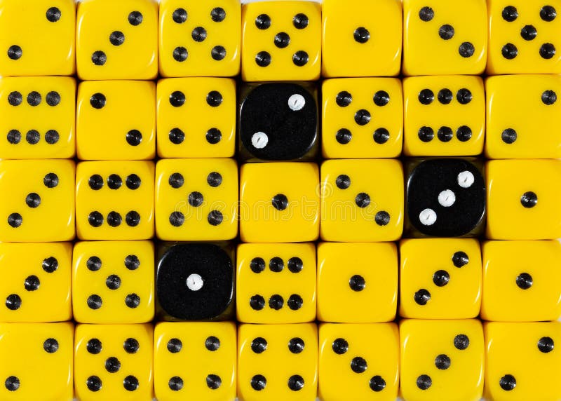 Background of random ordered yellow dices with three black cubes stock image