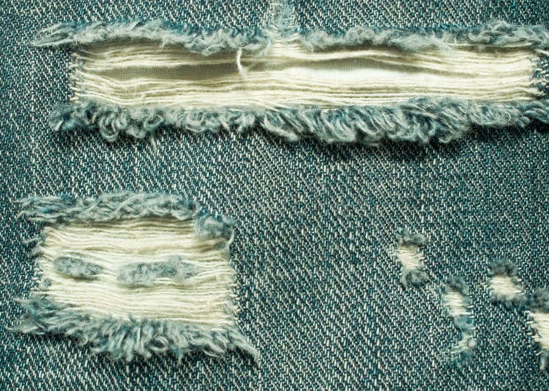 Background of the ripped jeans royalty free stock images