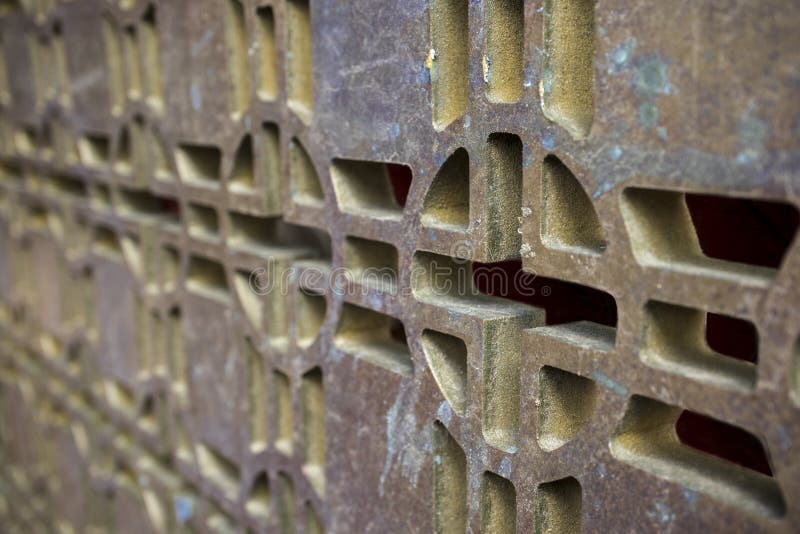 Background of a Rusty Metallic Grate in Bronze, with Green Spots Stock