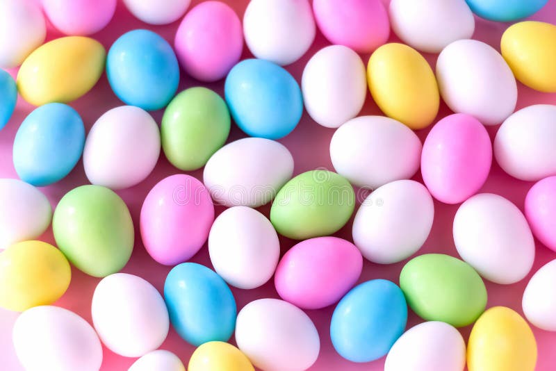 Background Small colorful candy eggs in the stand. Easter celebrate concept. Close up