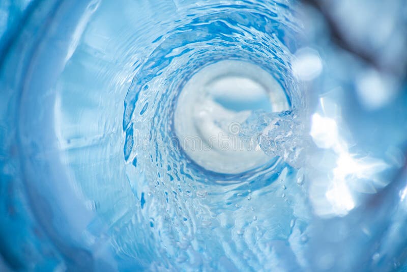 Background with a stream of blue clear liquid with bokeh is macro, water, swirl, bubble, clean, flow, circle, light, bright, fresh, fluid, natural, wet, abstract, aqua, white, drop, cold, vortex, freshness, backdrop, drain, transparent, whirlpool, space, wash, flowing, pure, wave, motion, hole, splash, funnel, circular, purity, curve, beverage, underwater, splashing, droplet, pour, radial. Whirlpool vortex water stock images, royalty-free photos and pictures