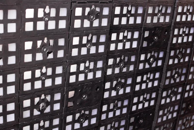 Background or texture of black plastic mesh stock photography