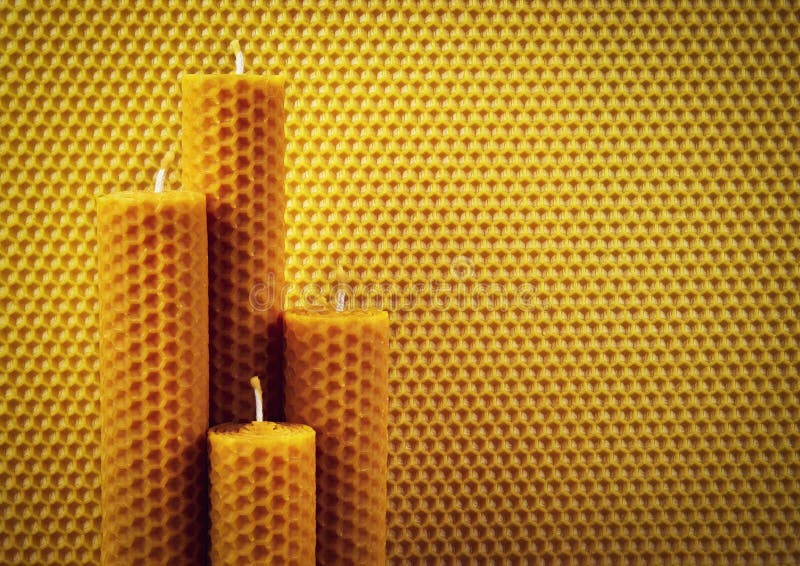 Two yellow beeswax candles stock image. Image of aroma 206864871